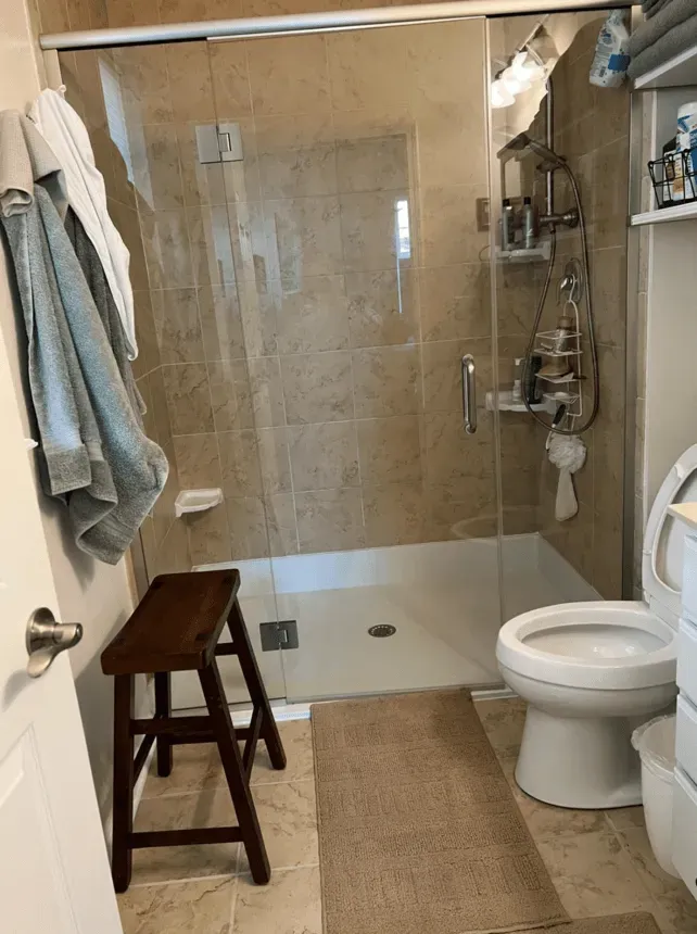Sparkling tiled walk-in shower after a deep clean